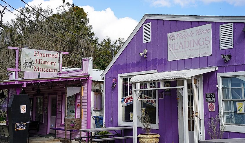 A street in Cassadadaga Spiritualist Camp, including the Purple Rose and Haunted History Museum, Cassadaga, Florida.